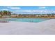 Community pool with deck chairs and clear blue water, surrounded by a concrete deck at 787 Redbud Ln, Summerville, SC 29486