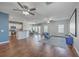 Open-concept living room with hardwood floors, ample natural light, and stylish ceiling fans at 787 Redbud Ln, Summerville, SC 29486