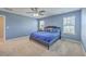 Comfortable bedroom with a ceiling fan and lots of light from the two large windows at 787 Redbud Ln, Summerville, SC 29486