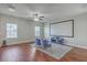 Media room with a large screen, comfortable seating, and a ceiling fan for entertainment at 787 Redbud Ln, Summerville, SC 29486