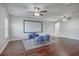 Media room with a large screen, comfortable seating, and a ceiling fan for entertainment at 787 Redbud Ln, Summerville, SC 29486