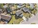 Aerial view of a home in a residential neighborhood with a well-maintained lawn and mature trees at 8005 Old Hazelwood Rd, North Charleston, SC 29406
