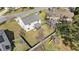 Aerial view of a home with a large, fenced backyard, a screened porch, and a playset at 8005 Old Hazelwood Rd, North Charleston, SC 29406