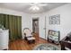 Cozy bedroom featuring wood floors, soft natural light, and reading nook at 8005 Old Hazelwood Rd, North Charleston, SC 29406