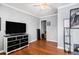 Well-lit bedroom with vinyl flooring, neutral paint, and ample closet space at 8005 Old Hazelwood Rd, North Charleston, SC 29406