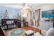 Bright Bedroom with wood floors, forest mural, and a comfortable reading chair at 8005 Old Hazelwood Rd, North Charleston, SC 29406