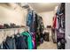 Organized walk-in closet with metal shelving, hanging rods, and ample storage space for clothing and accessories at 8005 Old Hazelwood Rd, North Charleston, SC 29406