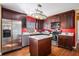 Modern kitchen features stainless steel appliances, a marble-topped island, and ample counter space at 8005 Old Hazelwood Rd, North Charleston, SC 29406