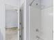 Bathroom shower/tub combo with a clear door frame leading into the bedroom at 8147 Shadow Oak Dr, North Charleston, SC 29406