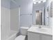 Bathroom showcasing a white sink, toilet, bathtub and modern fixtures with blue accent walls at 8147 Shadow Oak Dr, North Charleston, SC 29406