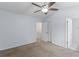 Bedroom with neutral carpeting and a view to the upper level via the entry door at 8147 Shadow Oak Dr, North Charleston, SC 29406