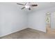 Bedroom with neutral carpeting and a view to the en-suite bathroom at 8147 Shadow Oak Dr, North Charleston, SC 29406