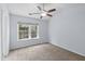 Bedroom featuring a ceiling fan and light with a window at 8147 Shadow Oak Dr, North Charleston, SC 29406