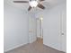 Bedroom featuring neutral carpet, a ceiling fan, and a door leading to another room at 8147 Shadow Oak Dr, North Charleston, SC 29406