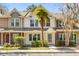 Charming townhome featuring manicured landscaping, a quaint front yard, and a welcoming entryway at 8147 Shadow Oak Dr, North Charleston, SC 29406