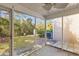 Covered screened porch with concrete floors and views of the grassy backyard at 8147 Shadow Oak Dr, North Charleston, SC 29406