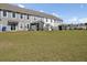 View of the home's backyard at 9712 Transplanter Cir, Ladson, SC 29456