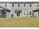 View of the home's backyard featuring a lawn at 9712 Transplanter Cir, Ladson, SC 29456