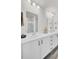 Bright bathroom featuring double sink vanity and a large mirror at 9712 Transplanter Cir, Ladson, SC 29456