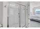 Bathroom featuring a large walk-in shower with sliding glass doors at 9712 Transplanter Cir, Ladson, SC 29456