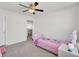 Bright bedroom featuring carpet floors, ceiling fan and single bed at 9712 Transplanter Cir, Ladson, SC 29456
