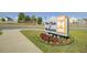 Entrance sign for 'The Club at Mckewn' featuring a landscaped flower bed and neighborhood views at 9712 Transplanter Cir, Ladson, SC 29456