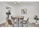 Bright dining area featuring modern furniture, stylish lighting, and easy access to the kitchen at 9712 Transplanter Cir, Ladson, SC 29456
