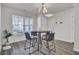 Bright dining area with a modern light fixture and large window at 9712 Transplanter Cir, Ladson, SC 29456