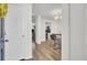 Bright entryway showcasing new flooring, modern lighting, and easy access to the kitchen at 9712 Transplanter Cir, Ladson, SC 29456