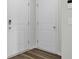 Clean hallway featuring doors and modern flooring at 9712 Transplanter Cir, Ladson, SC 29456