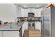 Modern kitchen with granite countertops, stainless steel appliances, and white cabinets at 9712 Transplanter Cir, Ladson, SC 29456
