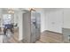 Spacious kitchen with stainless steel refrigerator and adjacent dining area at 9712 Transplanter Cir, Ladson, SC 29456