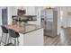 Modern kitchen featuring granite countertops, stainless steel appliances, and bar stool seating at 9712 Transplanter Cir, Ladson, SC 29456