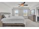 Serene main bedroom with ample natural light and a ceiling fan at 9712 Transplanter Cir, Ladson, SC 29456
