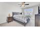 Neutral bedroom featuring a ceiling fan and lots of natural light at 9712 Transplanter Cir, Ladson, SC 29456