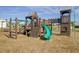 Community playground equipment featuring slides, climbing structures, and swings for outdoor fun at 9712 Transplanter Cir, Ladson, SC 29456
