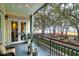 Charming balcony with a view of a landscaped park and waterfront at 1 Vendue Range # D, Charleston, SC 29401