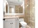 Bathroom featuring a glass enclosed shower, white vanity, and neutral color scheme at 1 Vendue Range # D, Charleston, SC 29401