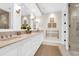 Bathroom featuring double vanity, marble countertop, and modern fixtures at 1 Vendue Range # D, Charleston, SC 29401