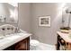 Powder room showcasing unique wallpaper, marble countertop, and elegant lighting at 1 Vendue Range # D, Charleston, SC 29401