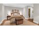 Cozy bedroom with wood floors, crown molding, and en suite bathroom at 1 Vendue Range # D, Charleston, SC 29401