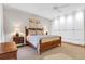Relaxing bedroom with a king-size bed, white ceiling fan and custom built-in wardrobe at 1 Vendue Range # D, Charleston, SC 29401