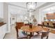Charming breakfast nook offering warm lighting, views into kitchen, and a wooden table at 1 Vendue Range # D, Charleston, SC 29401