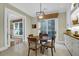 Quaint breakfast nook with a view, wooden table set, and custom-built cabinets at 1 Vendue Range # D, Charleston, SC 29401