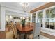 Bright dining room features a chandelier, a large window, and seamless access to the living room at 1 Vendue Range # D, Charleston, SC 29401
