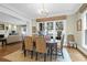 Chic dining room offers an elegant chandelier with views into the living area at 1 Vendue Range # D, Charleston, SC 29401
