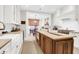 Gourmet kitchen with stainless steel appliances, custom cabinets, and a large island with countertop seating at 1 Vendue Range # D, Charleston, SC 29401