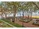 Serene park view featuring lush greenery, walking paths, benches, and mature trees at 1 Vendue Range # D, Charleston, SC 29401