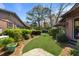 Landscaped backyard featuring a well-manicured lawn and mature trees at 1039 Grand Concourse St, Charleston, SC 29412