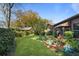 Well maintained back yard and garden with grass path with a small building in the background at 1039 Grand Concourse St, Charleston, SC 29412